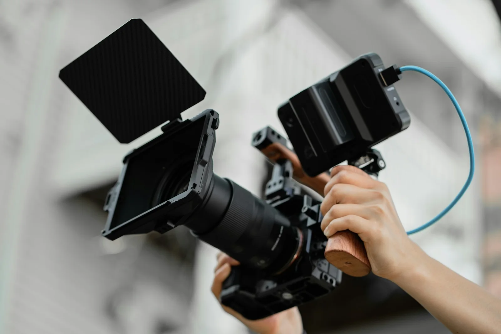 Creator operating a cinema camera rig