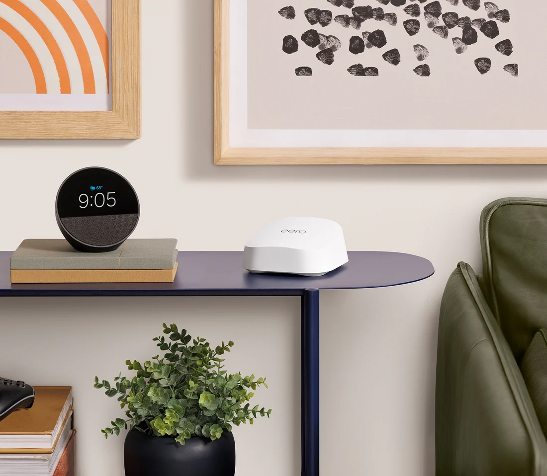 An eero 7 router beside an Amazon Echo smart speaker