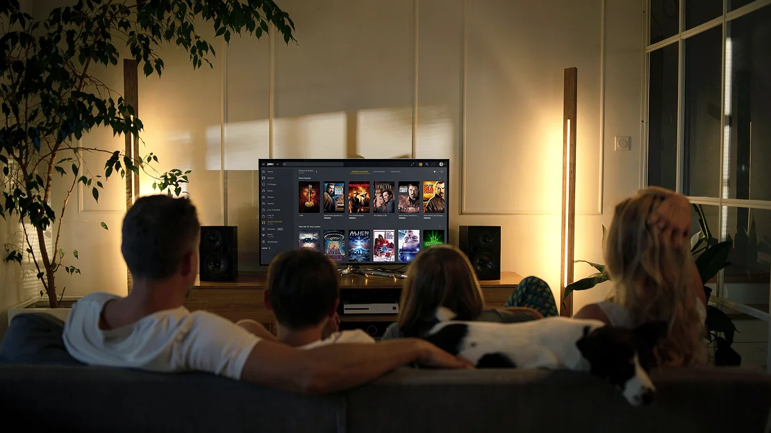 Family using a television connected to a Synology BeeStation Plus Plex library
